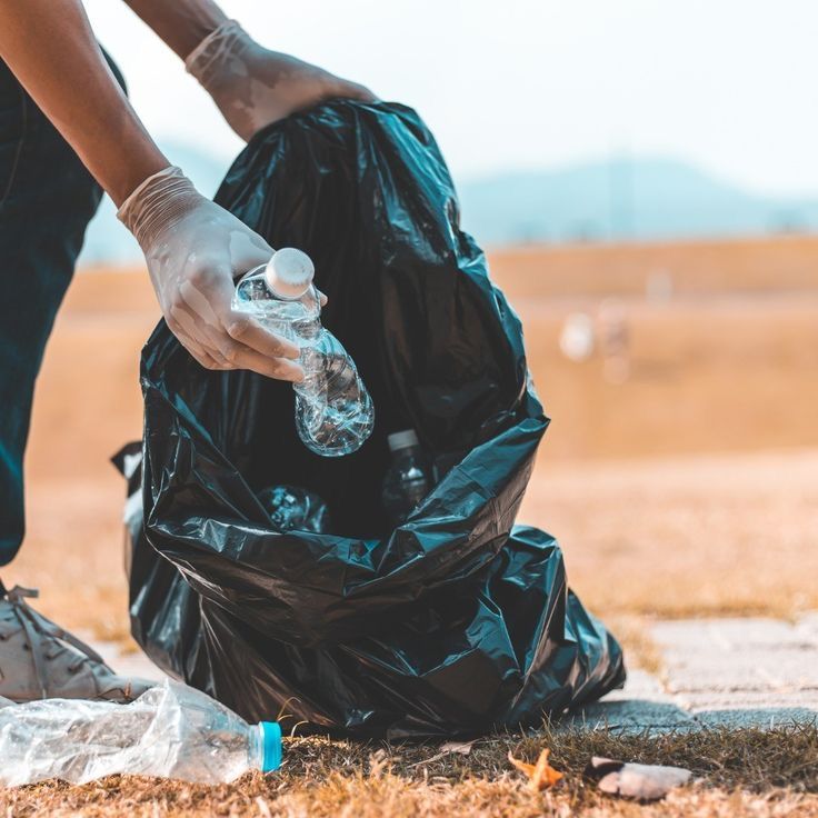 Volunteers cleaning plastic from a beach